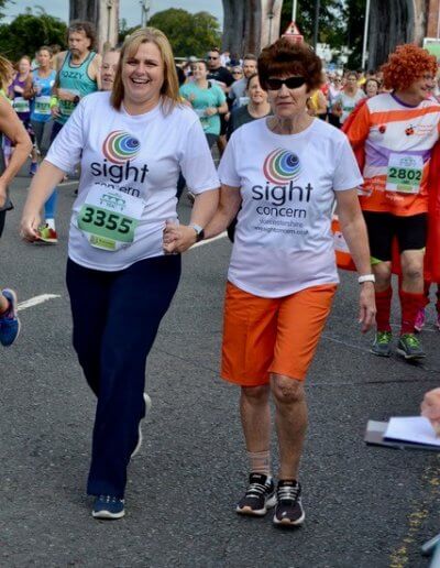 two runners representing sight concern at the worcester run 2019