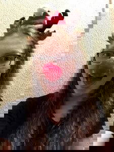 this is a photo of world champion paralympian swimmer becky redfern wearing a red nose and antlers